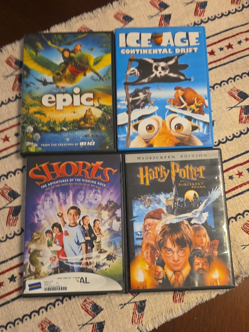 Set of 4 Family DVDs — Epic, Ice Age: Continental Drift, Shorts, Harry Potter
